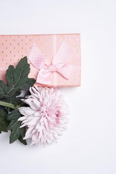 pink gift box flower bouquet holiday light background. High quality photo