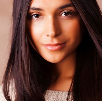 cute happy young indian woman in studio closeup smiling on brown background, fashion beauty lifestyle people concept close up