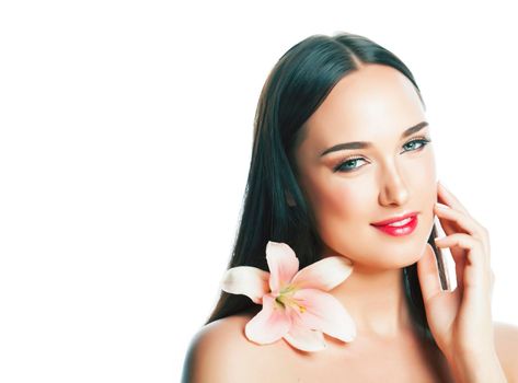 young attractive lady closeup with hands on face isolated flower lily brunette spa nude makeup, beauty concept