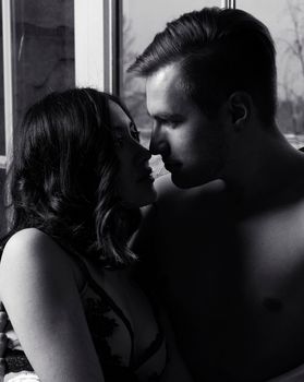 young pretty couple together in bed sleeping chill, lifestyle people concept, black and white close up