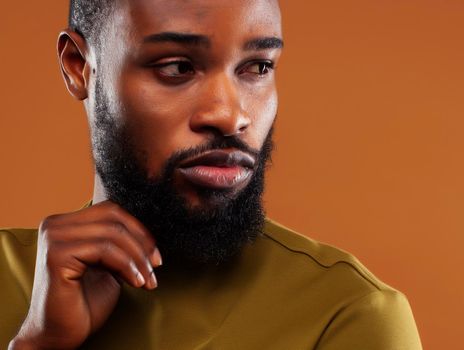 young pretty african american man posing cheerful on brown background, lifestyle people concept close up