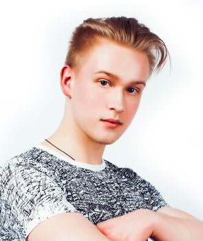 young handsome teenage hipster guy posing emotional, happy smiling against white background isolated, lifestyle people concept close up