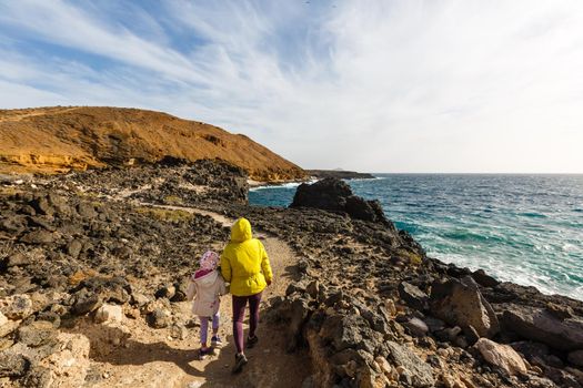 mother with little daughter travel in mountains tenerife