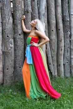 Sexy woman outdoor with nice colorful dress. Fashion