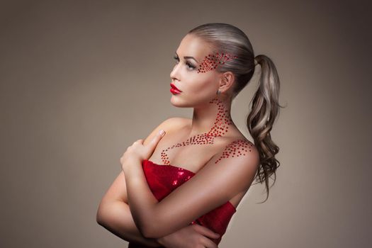 Fashion Blonde Model Portrait. Professional Red Makeup over dark background