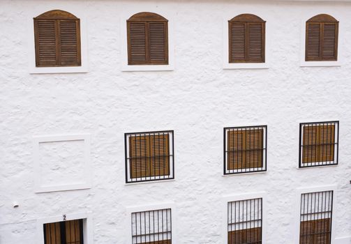 The wall with windows of the old building.