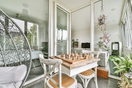 Pretty room design with a chess table