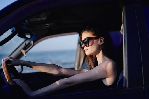 woman driving in car trip posing fashion travel. High quality photo