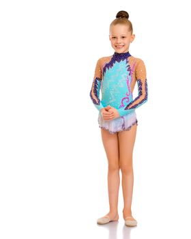 A nice little girl gymnast, in a beautiful gymnastic swimsuit for competitions. In full growth. The concept of advertising sports goods, the physical development of children. Isolated on white background.