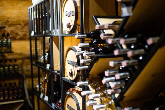 Interior of very old wine cellar with vintage wine pump and dried meat delicatessen