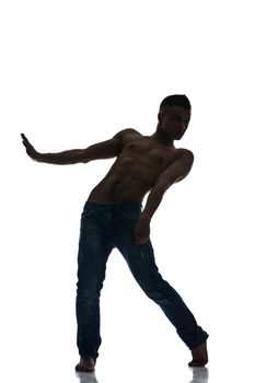 Full length silhouette of a young man dancer, isolated studio white background