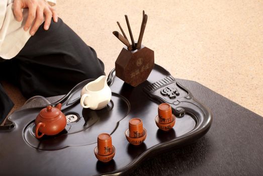 Chinese tea ceremony is perfomed by tea master in kimono