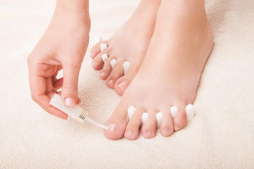 Woman's Feet isolated on white. Pedicure concept. Nails. Spa. Skincare. Depilation Epilation