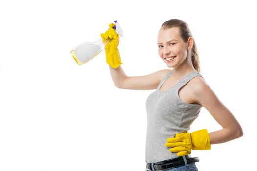 attractive beautiful young woman in yellow rubber gloves holding and spray isolated over white