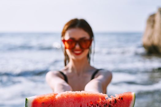 cheerful pretty woman in black swimsuit watermelon fashion travel. High quality photo