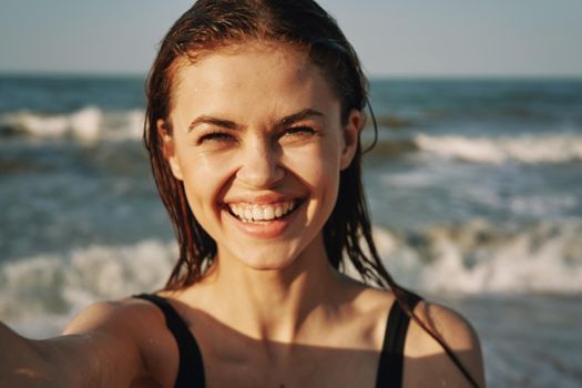 woman in black swimsuit sunglasses sun nature. High quality photo