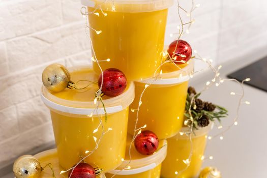 Christmas balls and jars of honey, New Year's spruce, golden balls.