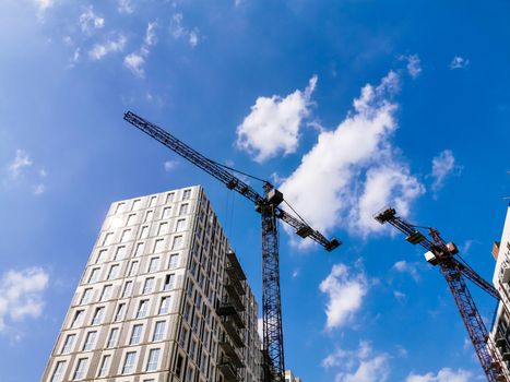 Construction site with concrete and steel and crane lifting equipment