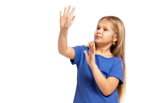 Portrait of adorable little girl isolated on a white background. in blue t-short with long white hair, showing hands