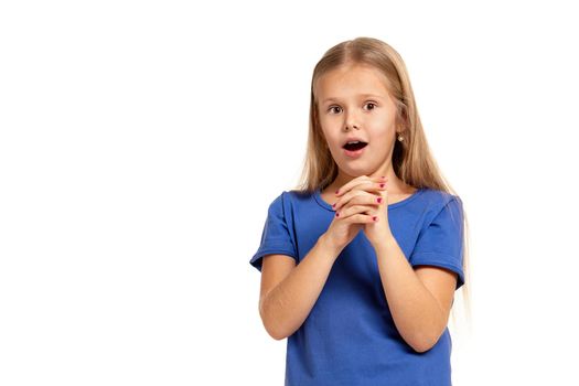 Portrait of adorable little girl isolated on a white background. in blue t-short with long white hair, surprised