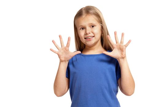 Portrait of adorable little girl isolated on a white background. in blue t-short with long white hair, showing hands