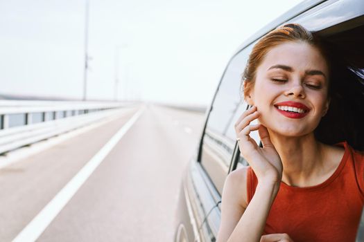 cheerful woman car ride road travel adventure. High quality photo