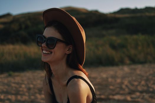 woman in sunglasses near car travel summer vacation landscape. High quality photo