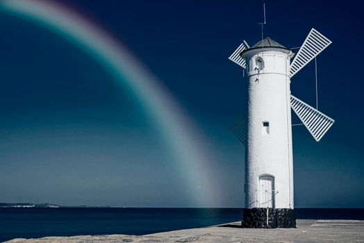 Swinoujscie, town's landmark with rainbow in infrared