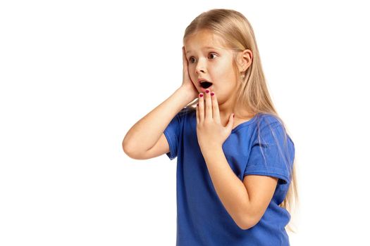 Portrait of adorable little girl isolated on a white background. in blue t-short with long white hair, worried, holding her head