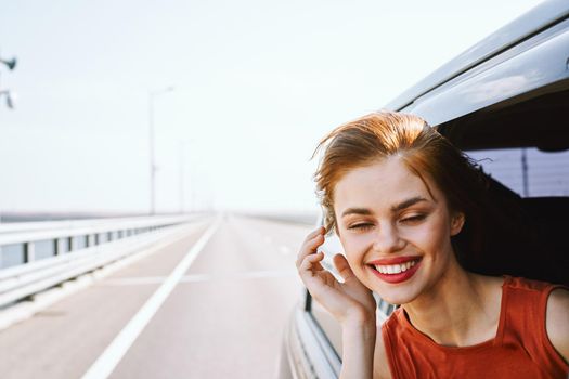 cheerful woman car ride road travel adventure. High quality photo