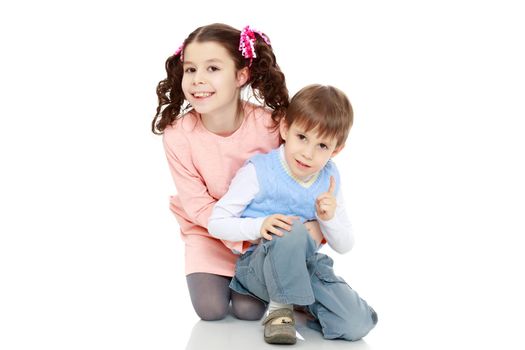 Brother and sister hugging each other. Boy and girl very happy.Isolated on white background.