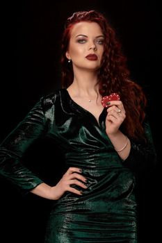 Gorgeous woman whith a red lips, curly hair and chips in her hands, over black. Win casino holdem poker slots