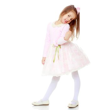 Dressy little girl long blonde hair, beautiful pink dress and a rose in her hair.She tipped to the side of the head.Isolated on white background.