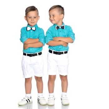 Two little brothers of Gemini together are sad. Isolated on white background