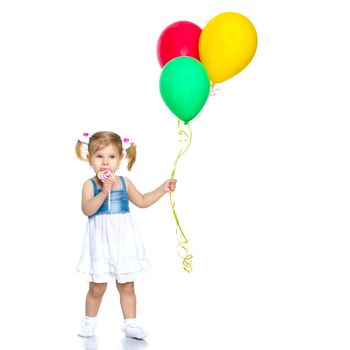 Little girl is playing with a balloon. The concept of the holiday, birthday. Isolated over white background