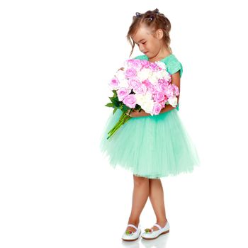 Little girl with a beautiful bouquet of flowers. The concept of holidays, family and children. Isolated on white background.