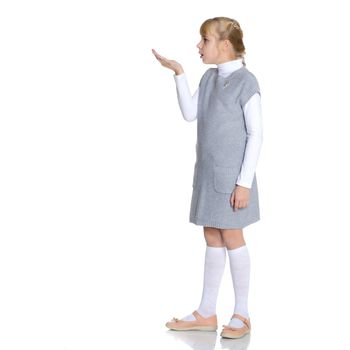 Little girl blowing on the palm. The concept of a happy childhood. Isolated on white background