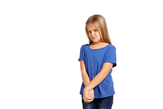 Portrait of adorable little girl isolated on a white background. in blue t-short with long white hair, shying stand