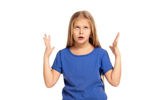 Portrait of adorable little girl isolated on a white background. in blue t-short with long white hair disappointed