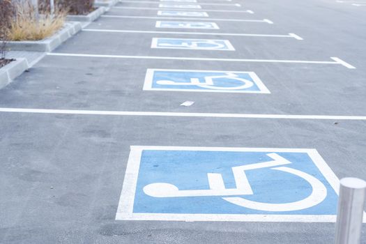 Handicapped Symbol Painted on a Parking Spot.