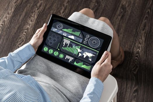 close-up business woman with computer tablet on lap