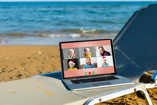 laptop on a sun lounger on the beach