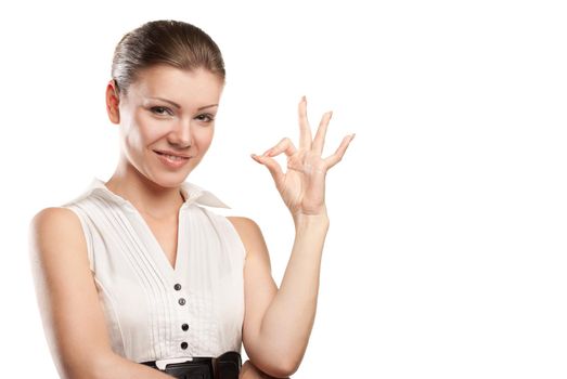 Beautiful young woman signaling ok. Isolated over white background