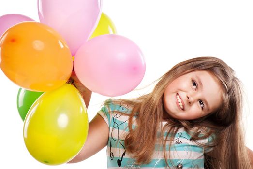 Little girl with colourful balloons on a white background
