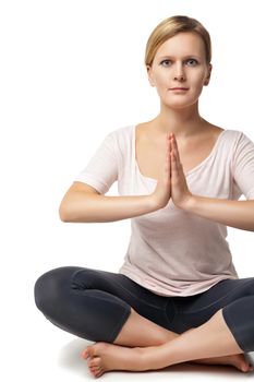 Young woman doing yoga isolated against white background