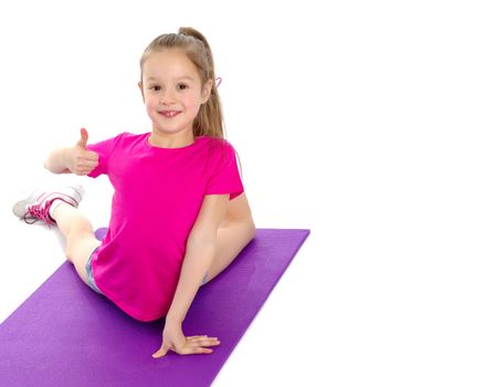 Little girl holding her thumb up. Concept Happy childhood, holiday, birthday.Isolated on white background