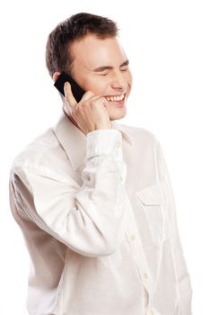 Young and healthy man smiling and talking on phone over white background