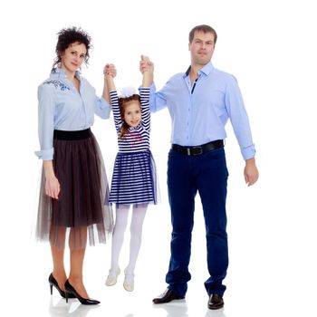 Happy young family, mom dad and little daughter.Parents raise the girl's hands.Isolated on white background.