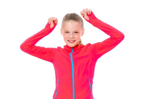 A girl gymnast performs an acrobatic element. The concept of childhood, sport, healthy lifestyle. Isolated on white background.