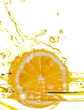 photo of the lemon slice fall in water with splash isolated on white